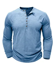 Detailed front view of a men's light blue slub cotton long sleeve Henley shirt with buttons