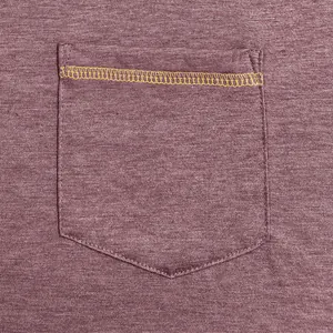 Close-up of men's T-shirt pocket with yellow contrast stitching on heathered fabric