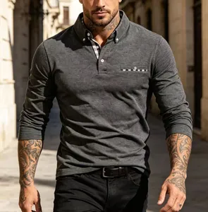 Close-up of a men's long-sleeved charcoal grey polo shirt featuring plaid collar details