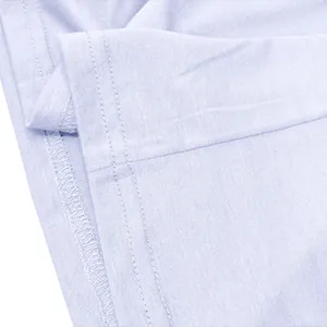 Close-up of neat double-stitch hem on a lavender cotton long-sleeved T-shirt.