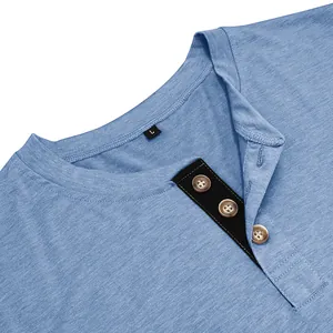 Close-up of breathable cotton fabric and buttons on a men's blue Henley shirt
