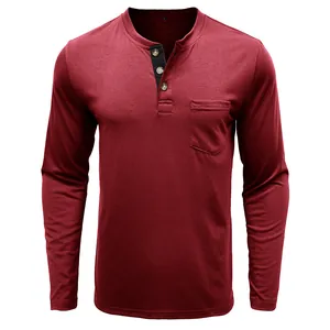 Detail view of a men's burgundy long-sleeved cotton slim-fit Henley shirt with a pocket