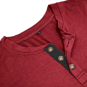 Close-up of wine red men's cotton Henley T-shirt with black button placket detail