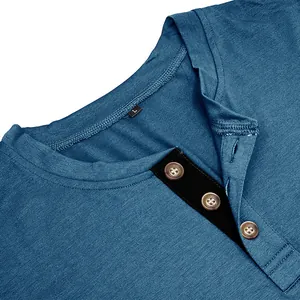 Close-up detail view of a men's blue Henley shirt collar featuring buttons and a size tag