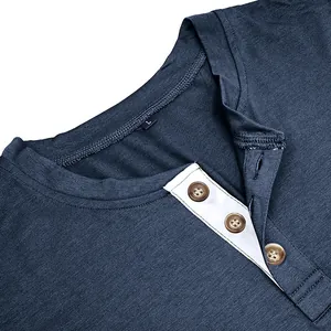 Close-up detail of a men's navy Henley shirt featuring a white placket and brown buttons
