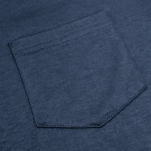 Close-up detail of a navy blue chest pocket on a breathable cotton men's T-shirt texture.