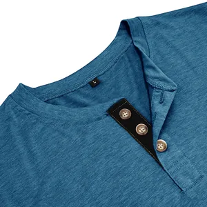 Detail view of men's blue Henley neck cotton T-shirt with contrast button placket.