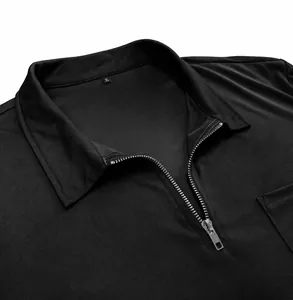 Close-up of black men's polo shirt featuring a metal zipper and turn-down collar.