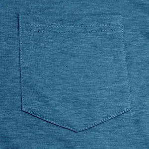 Close-up detail of a classic chest pocket on a blue heathered knit cotton t-shirt fabric