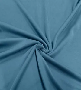 Detailed macro view showing the premium blue knitted fabric texture of a men's polo shirt
