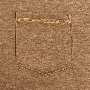 Macro detail of a pocket on a brown quick-dry Henley T-shirt