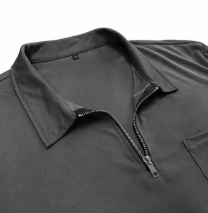 Detail view of a men's long-sleeve polo shirt with a half-zip collar and textured fabric.