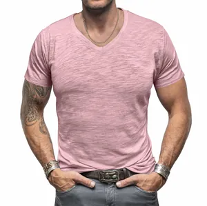 Close-up detail showing the slub cotton texture of this pink men's V-neck T-shirt