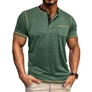 Detailed view of green men's Henley shirt with orange stitching and breast pocket