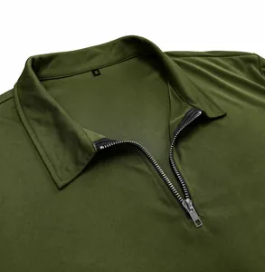 Macro view of olive green men's slim fit polo shirt featuring a durable metal zipper collar.