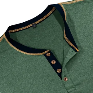 Close-up detail of a men's green Henley t-shirt with navy contrast collar and buttons