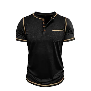 Close-up of black Henley shirt with gold contrast stitching and chest pocket detail