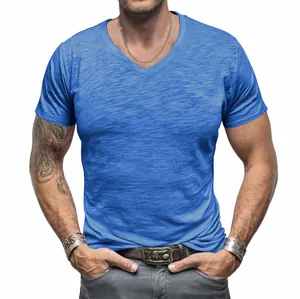 Detailed view of men's bright blue v-neck t-shirt in textured slub cotton fabric
