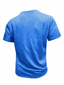 Macro view of blue slub cotton texture on men's casual short sleeve t-shirt back.