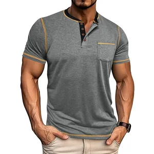 Detailed view of men's gray Henley T-shirt with yellow contrast stitching and pocket.