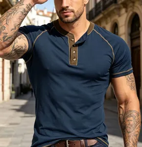 Close-up of navy Henley T-shirt with contrast green collar and stitching details