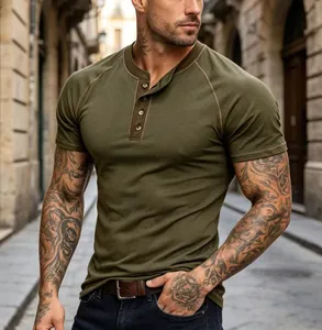 Detailed view of olive green men's Henley shirt featuring raglan sleeves and slim fit design