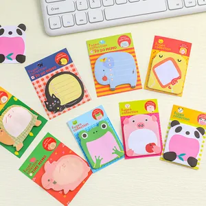 Collection of various cute cartoon animal-shaped sticky notes arranged on a work desk