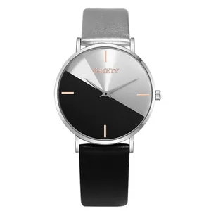 Close-up of minimalist two-tone women's quartz watch with split black and silver dial