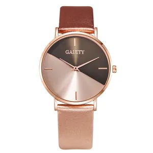 Detail view of a stylish women's quartz watch with a two-tone rose gold and grey dial.