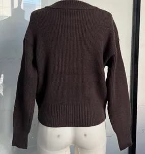 Detailed back view of a brown long-sleeved ribbed knit cardigan sweater on a mannequin