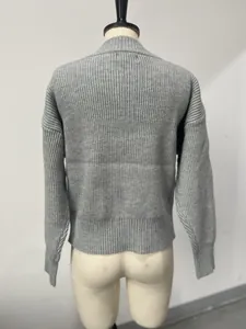 Back view of a grey ribbed long sleeve knit cardigan sweater on a mannequin stand.
