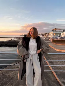 Chic long trench coat with contrast fur collar and belted waist for autumn winter