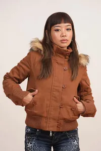 Close-up detail of retro brown jacket with faux fur hood trim and button closure
