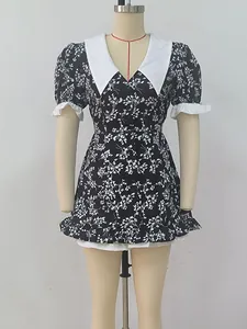 French style floral print mini dress with white doll collar on mannequin stand