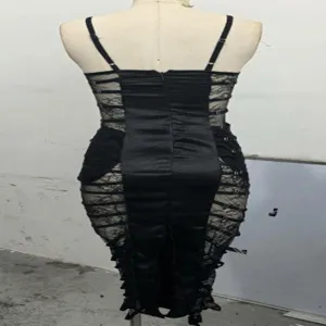 Detailed back view of a black lace splicing cami dress with bandage design and sheer panels.