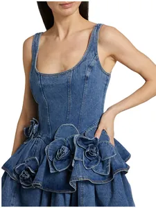 Stylish blue denim dress featuring large 3D rose appliqués and tiered ruffle skirt