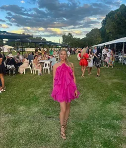 Vibrant pink halter neck ruffled mini dress for summer parties and beach vacations