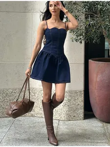 Elegant dark blue denim mini dress featuring a ruffled hem and slim fit waist design