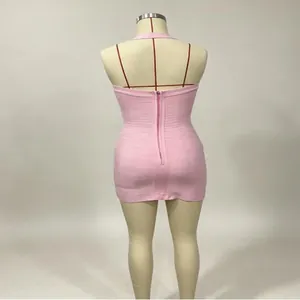Detailed back view of a pink halter neck bodycon bandage mini dress featuring back zipper