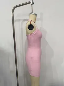 Side profile detail of pink ribbed bodycon mini dress on a dress form mannequin