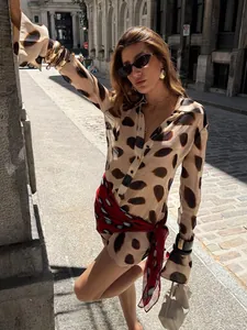 Elegant polka dot long sleeve shirt dress featuring a red patterned wrap tie waist for women