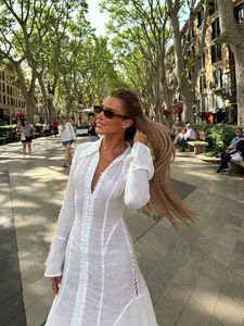 White textured pleated button-up shirt dress with flare sleeves and slim fit design