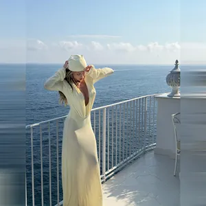 Elegant deep V-neck maxi dress with pleated waist and long sleeves for beach vacation