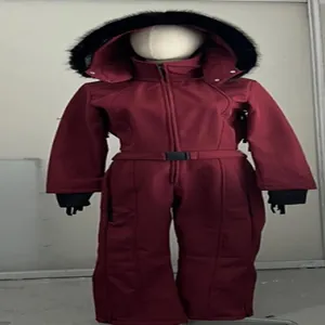 Front view of a warm maroon one-piece women's ski suit with fur hood detail.