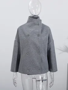 Detailed view of a grey stand collar double-breasted wool coat displayed on a mannequin