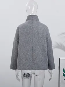 Back view of elegant grey wool blend coat with stand collar on clear mannequin