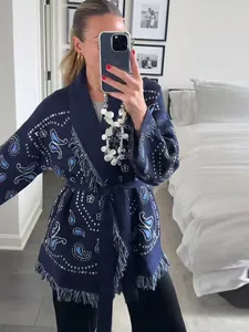 Elegant navy blue paisley knit cardigan with bohemian fringe hem and matching tie belt detail.