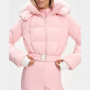 Close-up of a pink hooded ski jumpsuit featuring a quilted bodice and waist belt.