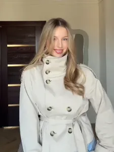 Elegant short beige trench coat with stand collar and waist tie for women's commute style.