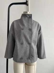 Detailed studio view of a grey stand-collar woolen coat displayed on a mannequin